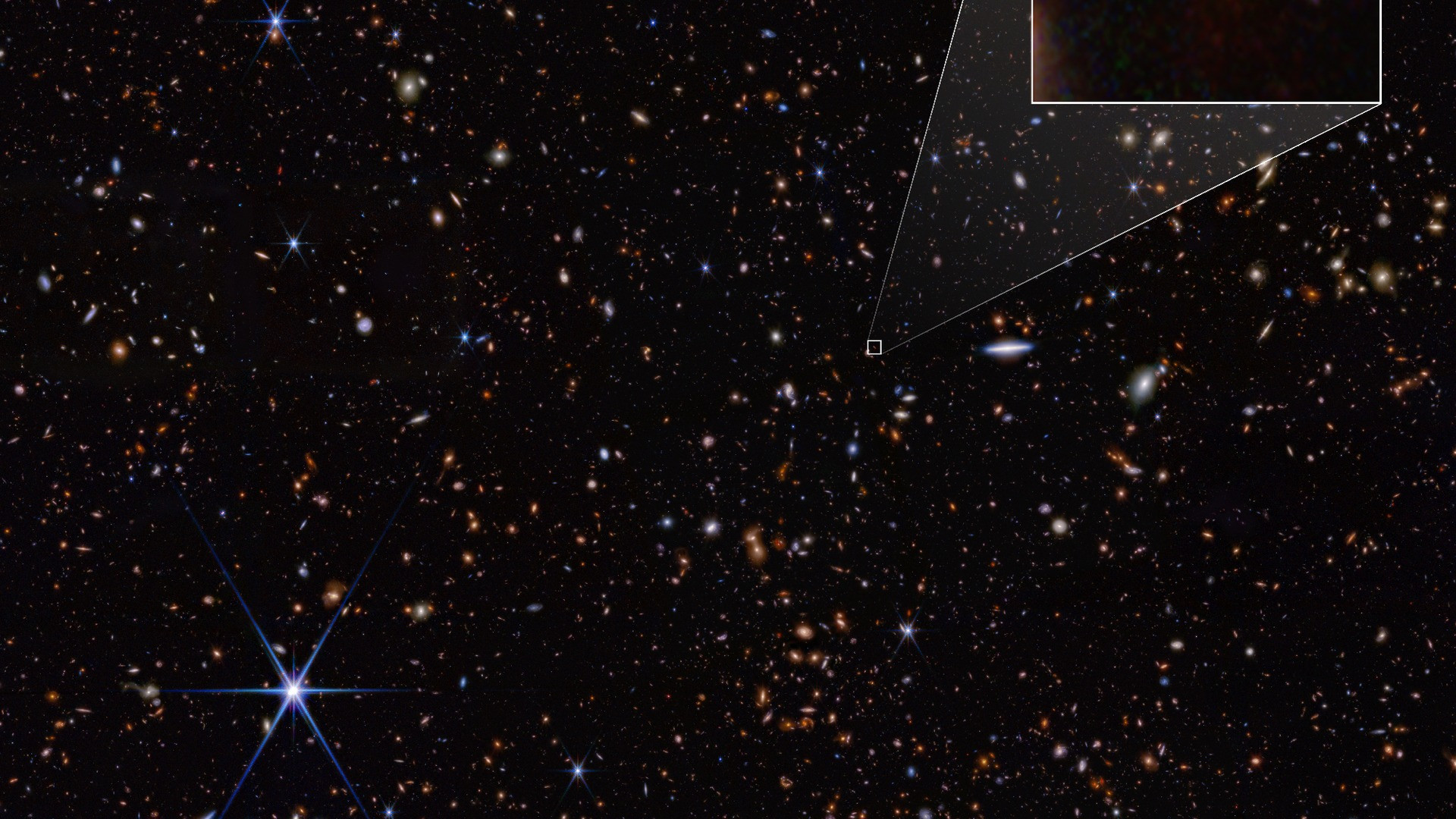 High-resolution infrared pullout image of high-redshift galaxy JADES-GS-z14-1 in deep space.