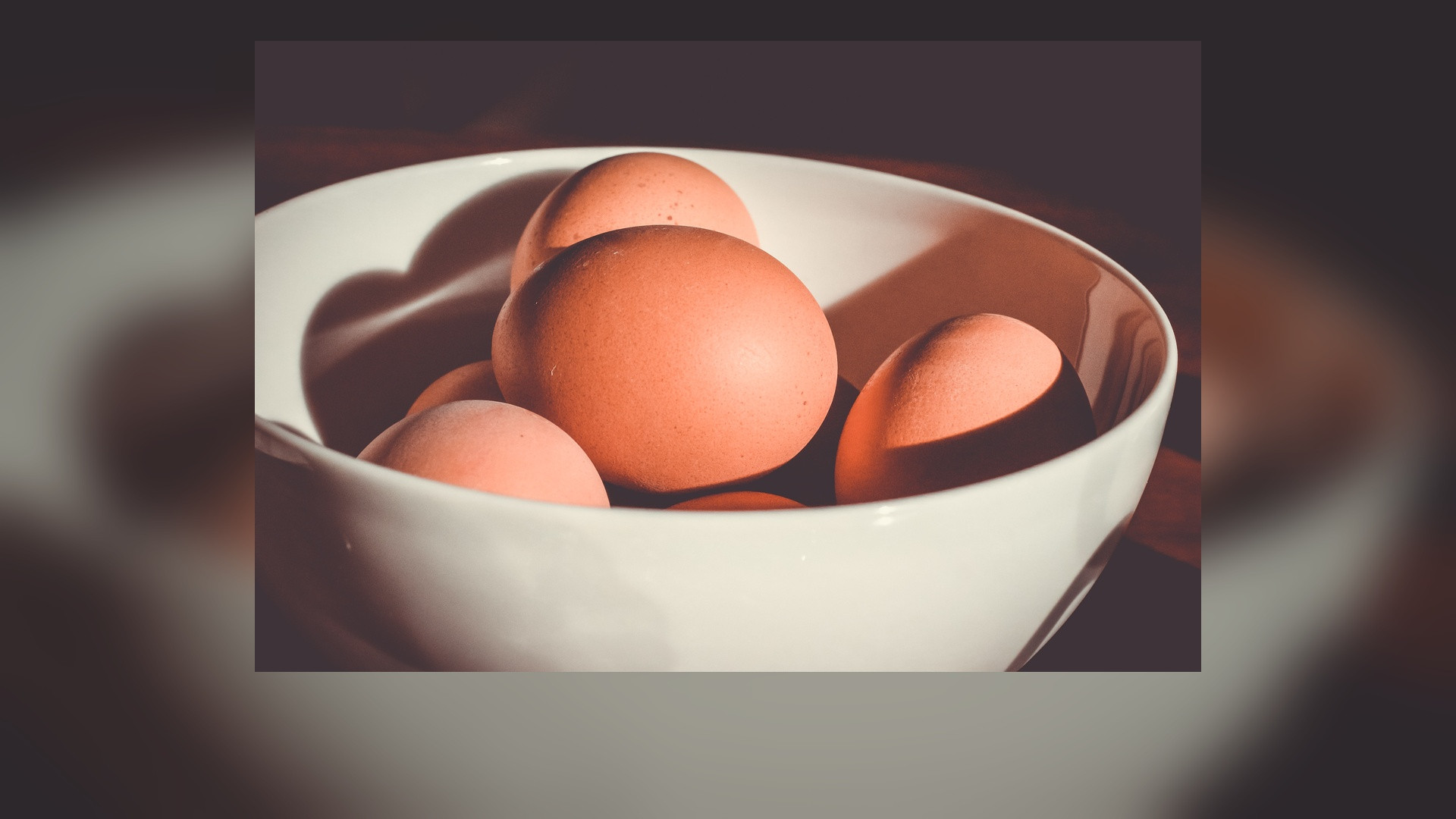 Farm-fresh boiled and poached eggs served with yolk exposed.