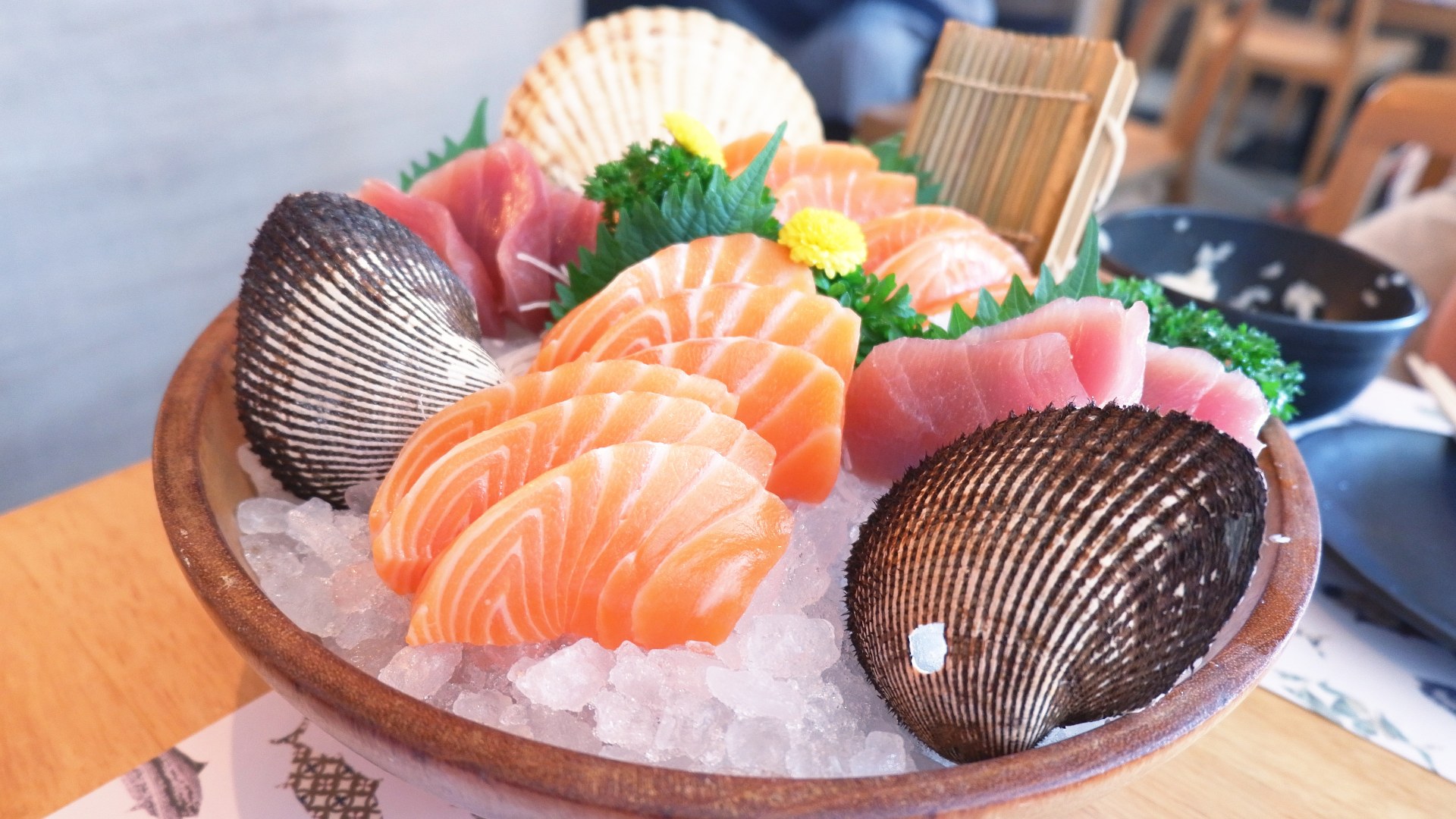 Freshly sliced sashimi grade tuna and seafood cuts served over ice