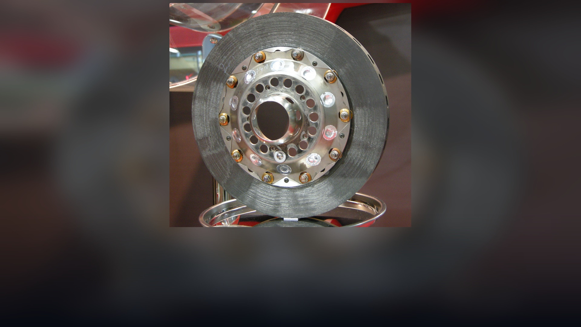 Carbon-composite Formula One brake disc assembly with cooling ventilation ducts.