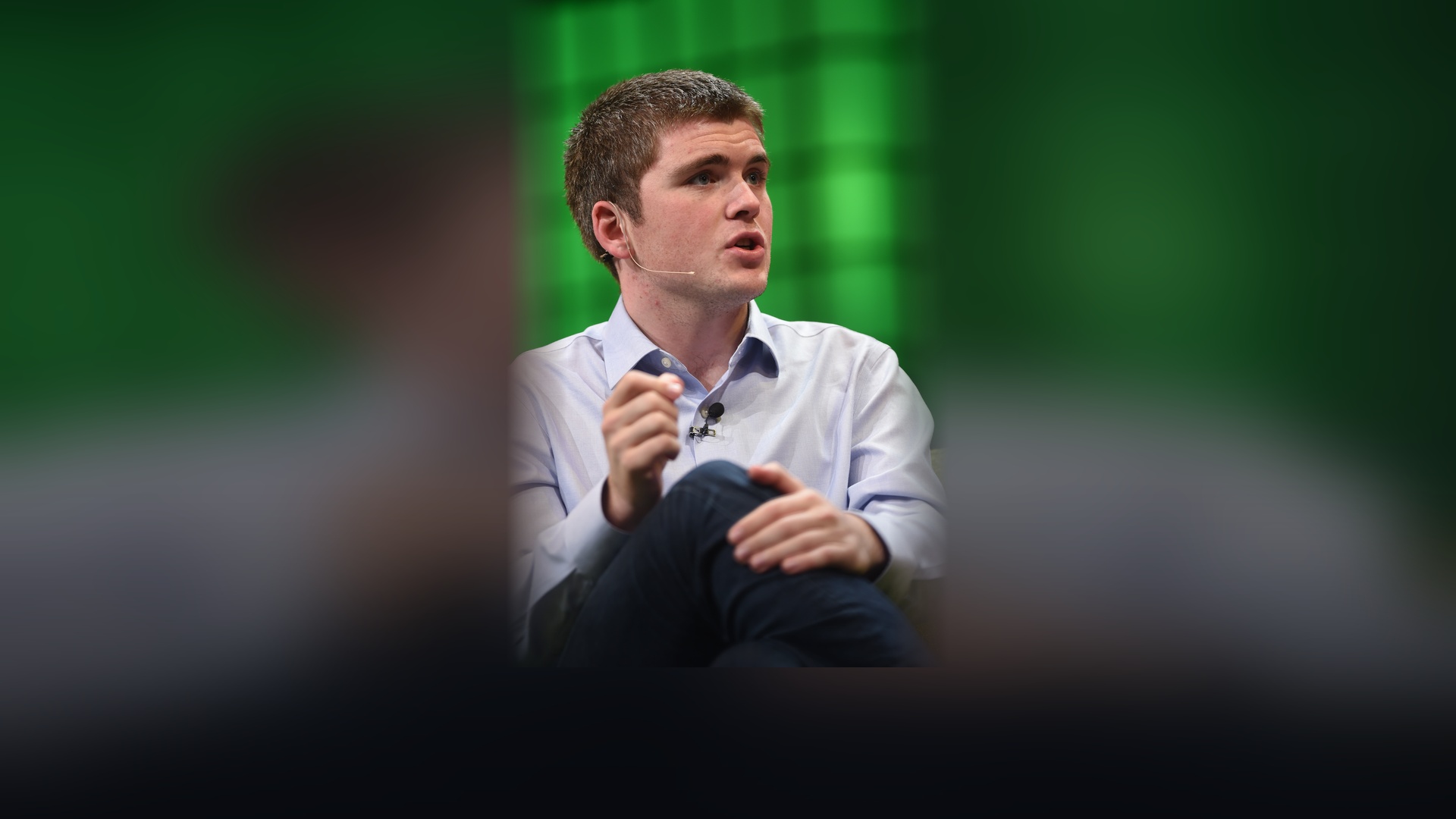 John Collison speaking during a technology panel at Web Summit.