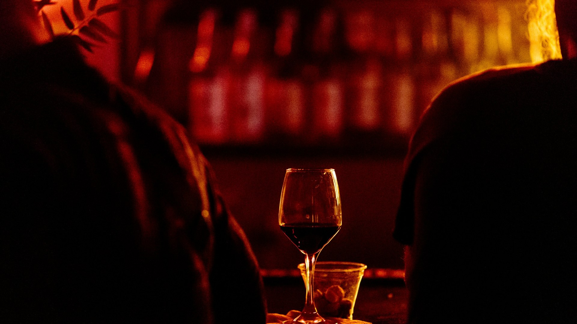 Evening wine glass on table illustrating nighttime alcohol consumption