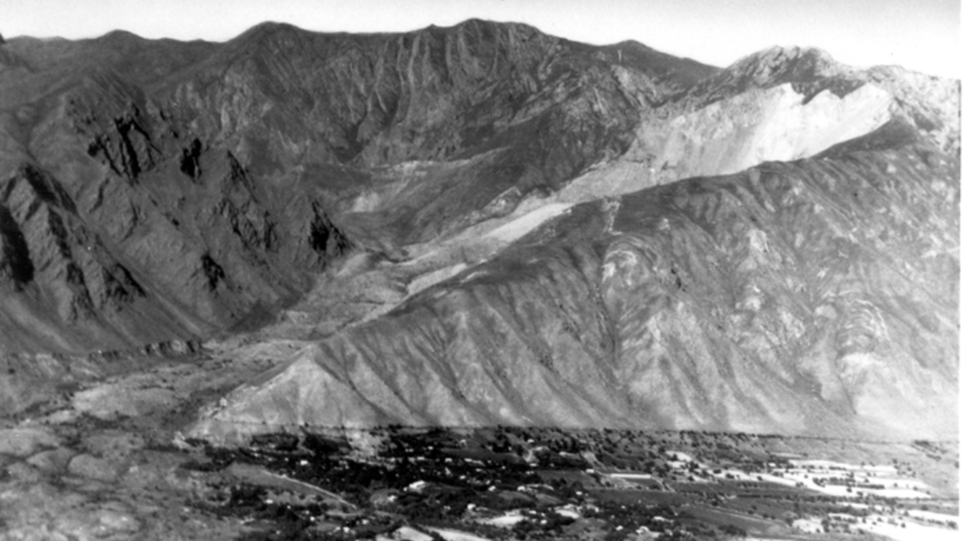 USGS aerial view of the massive 1949 Khait rock avalanche deposit burying the valley in Tajikistan.