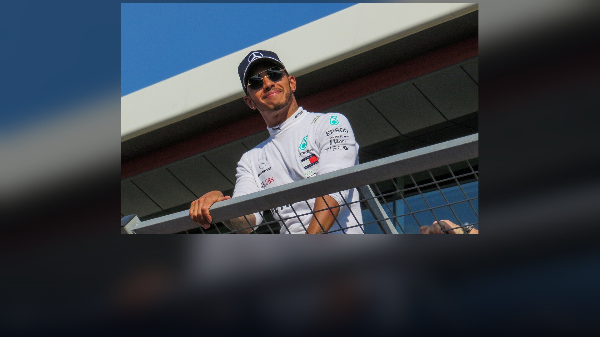 Lewis Hamilton cornering at maximum G-force in his Mercedes F1 car at Silverstone.