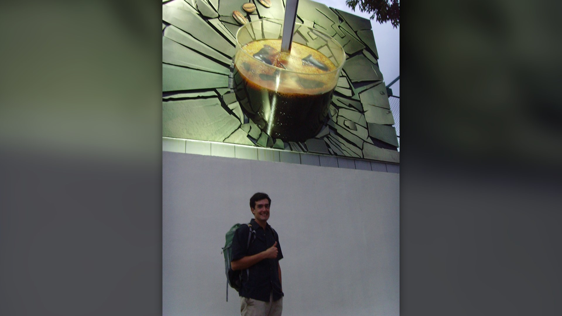 Tall glass of Vietnamese iced coffee with dark drip coffee and condensed milk