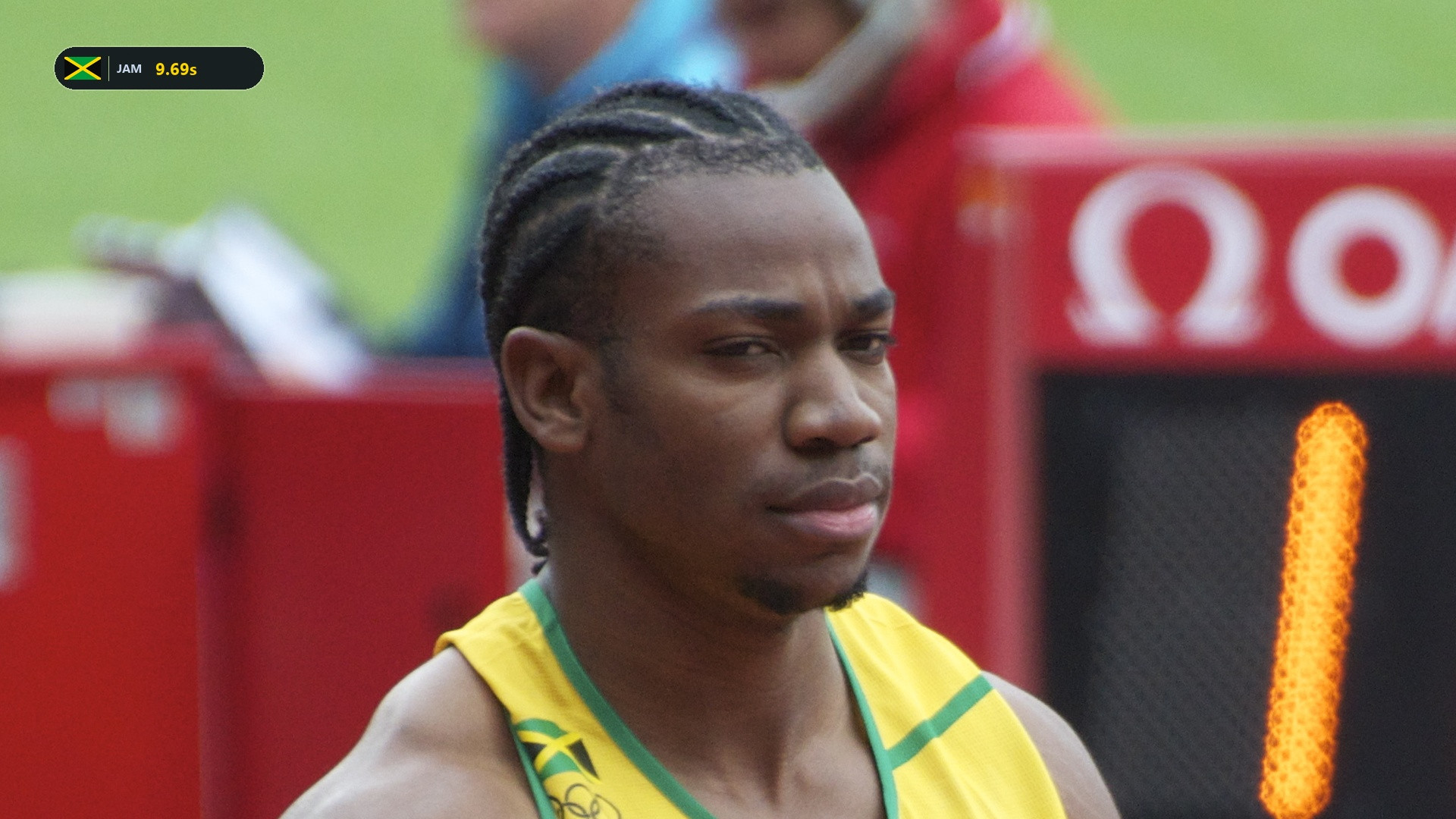 Yohan Blake in his yellow and green Jamaica kit with bib BLAKE.