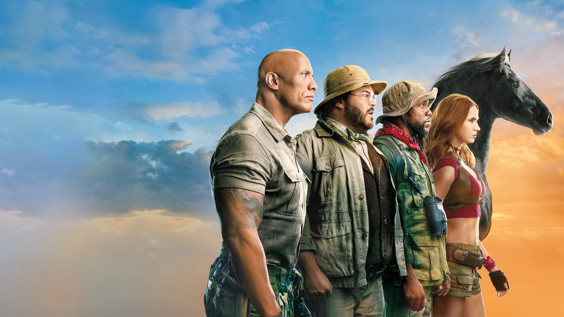 Dwayne Johnson as Dr. Smolder Bravestone standing firm in rugged desert expedition clothing.