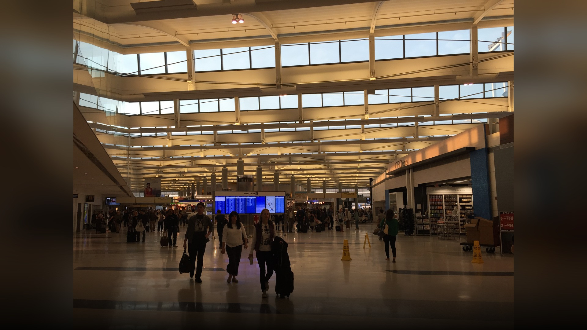 The modern glass architecture and control tower of Newark Liberty International Airport in New Jersey.