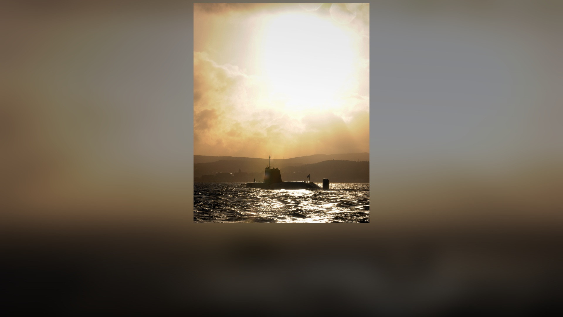 Royal Navy Astute-class nuclear submarine HMS Astute arriving at Faslane naval base