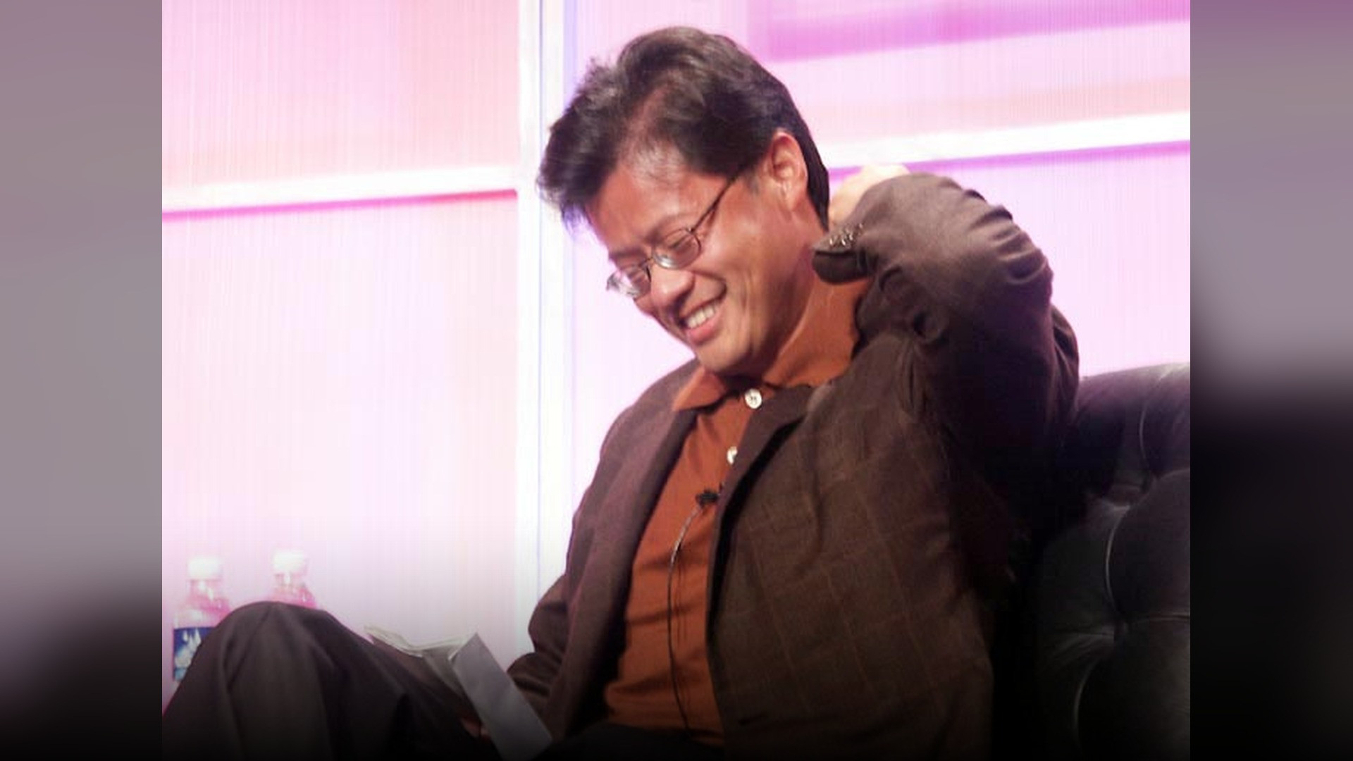 Jerry Yang smiling at a technology summit.