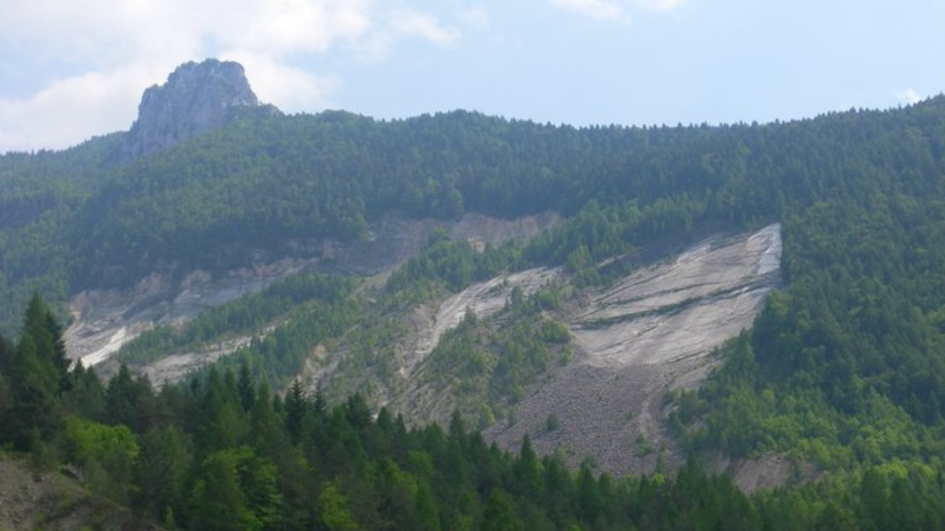 Landscape view of the massive Monte Toc landslide scar above the Vajont Dam gorge in northern Italy.