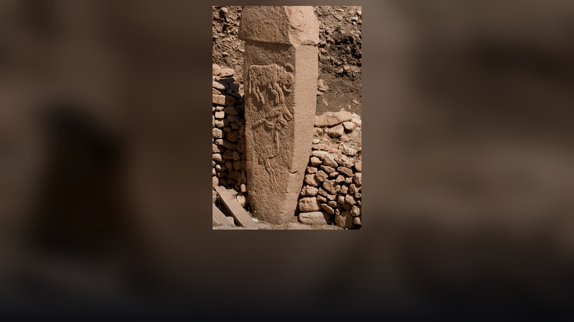 Massive circular megalithic stone enclosures and carved T-pillars at Göbekli Tepe.
