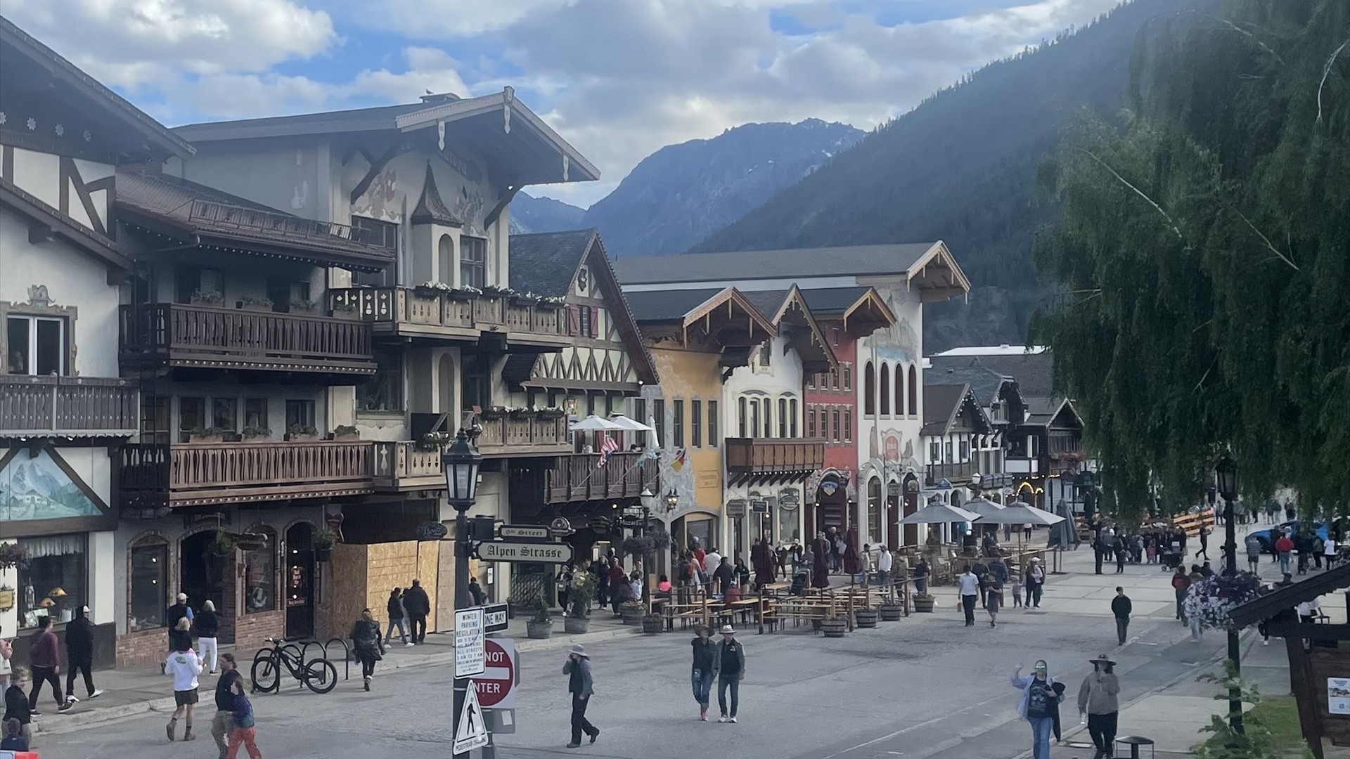Bavarian alpine buildings along Main Street in Leavenworth, Washington with Cascade mountains behind