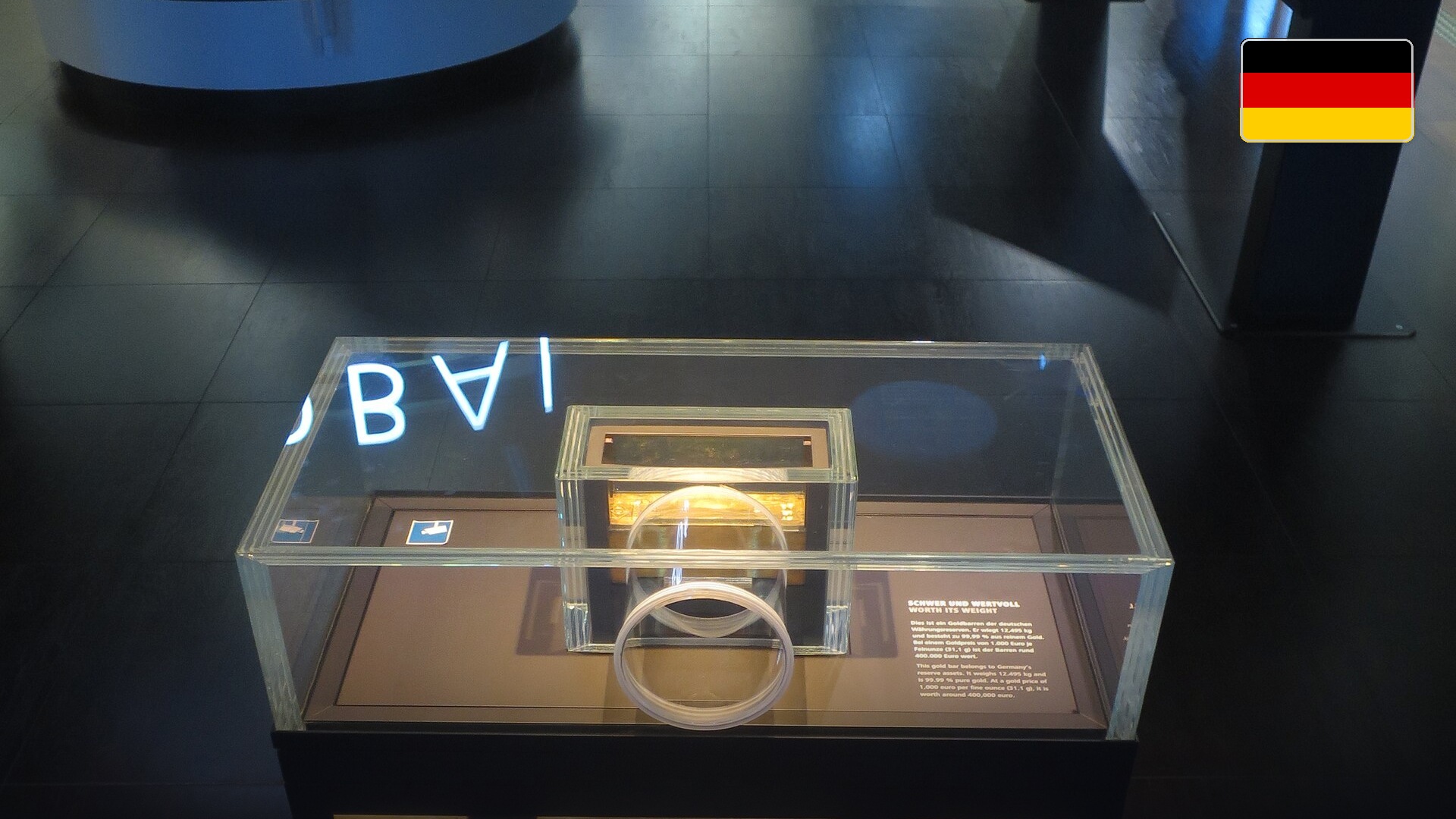 Official Deutsche Bundesbank gold reserve bullion bar in the Frankfurt Money Museum. Official national flag badge in top right.