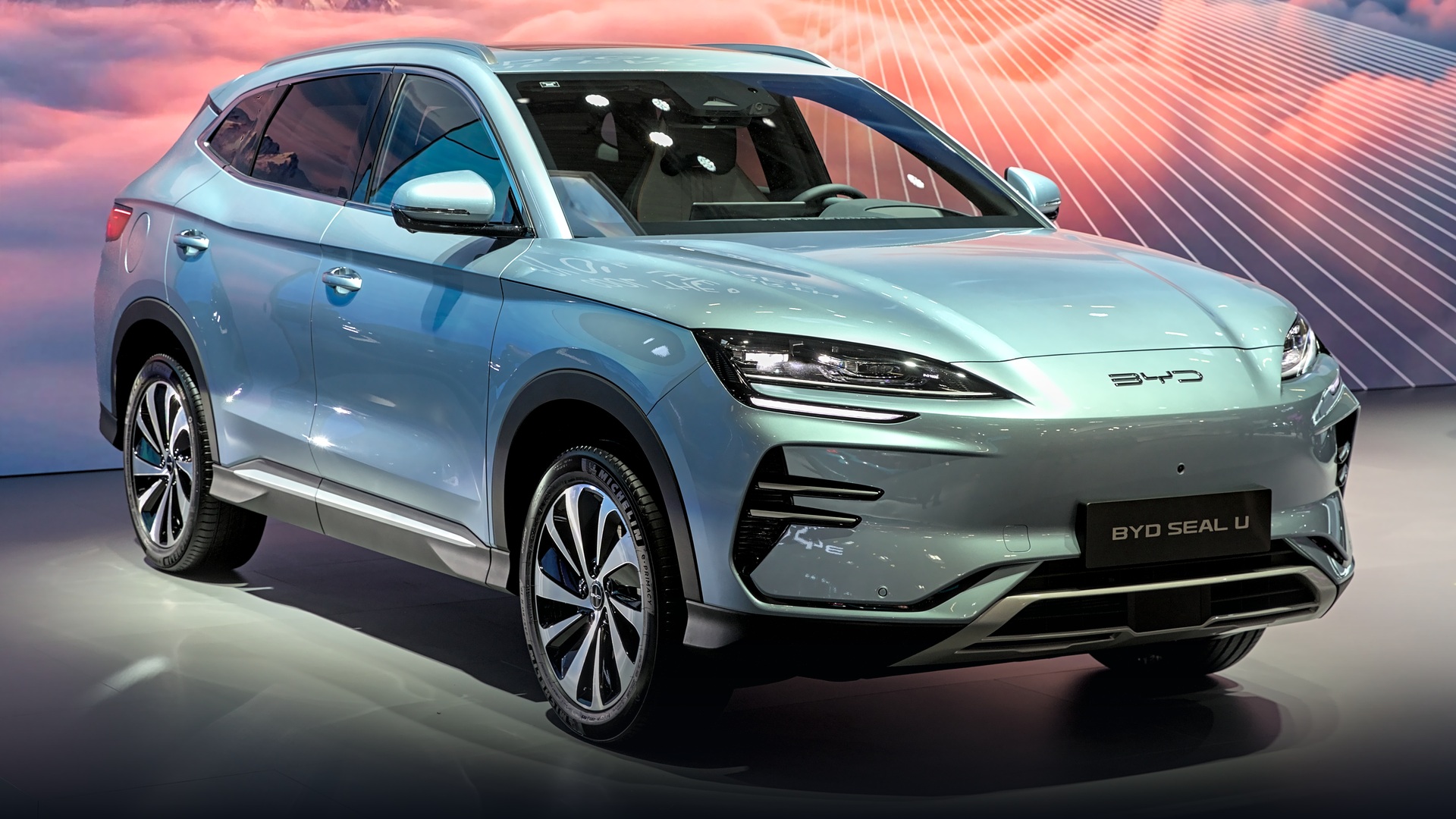 Sleek blue BYD Seal electric performance sedan on display at IAA Munich motor show.