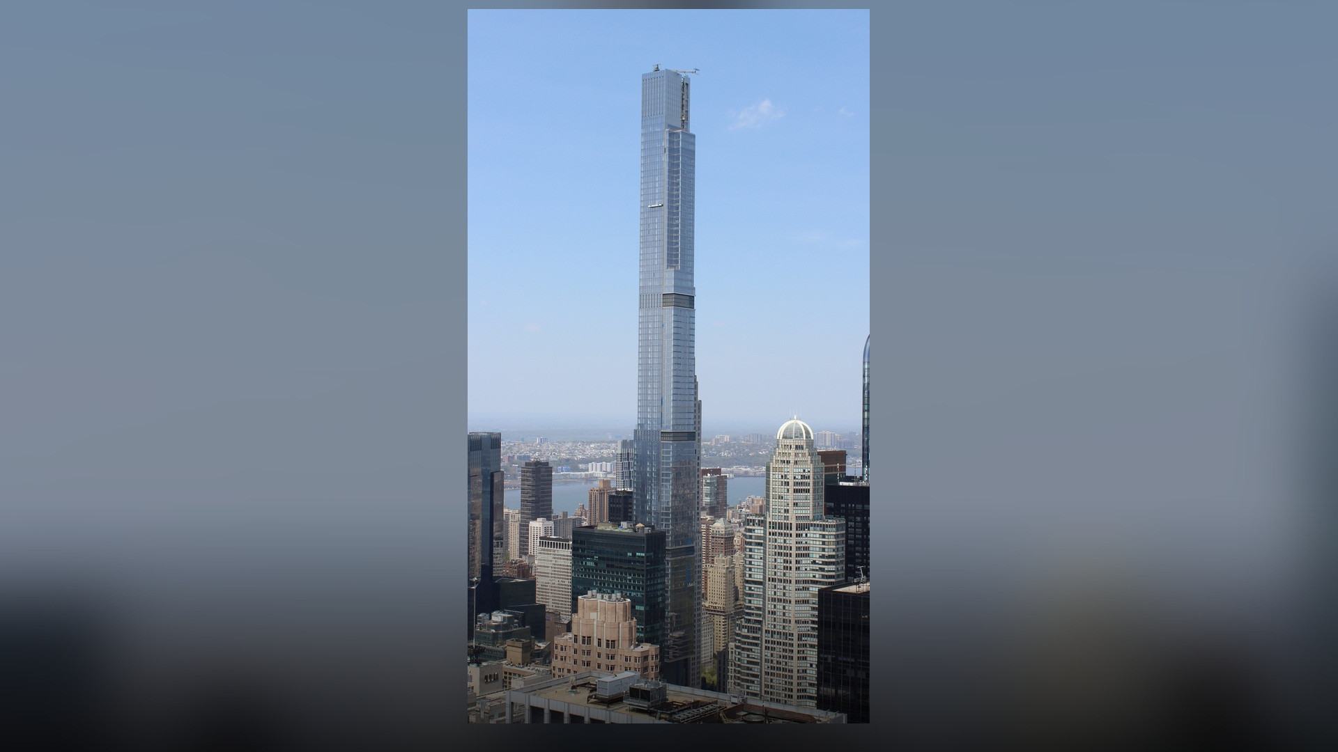 A towering view of Central Park Tower soaring 1,550 feet above 57th Street.