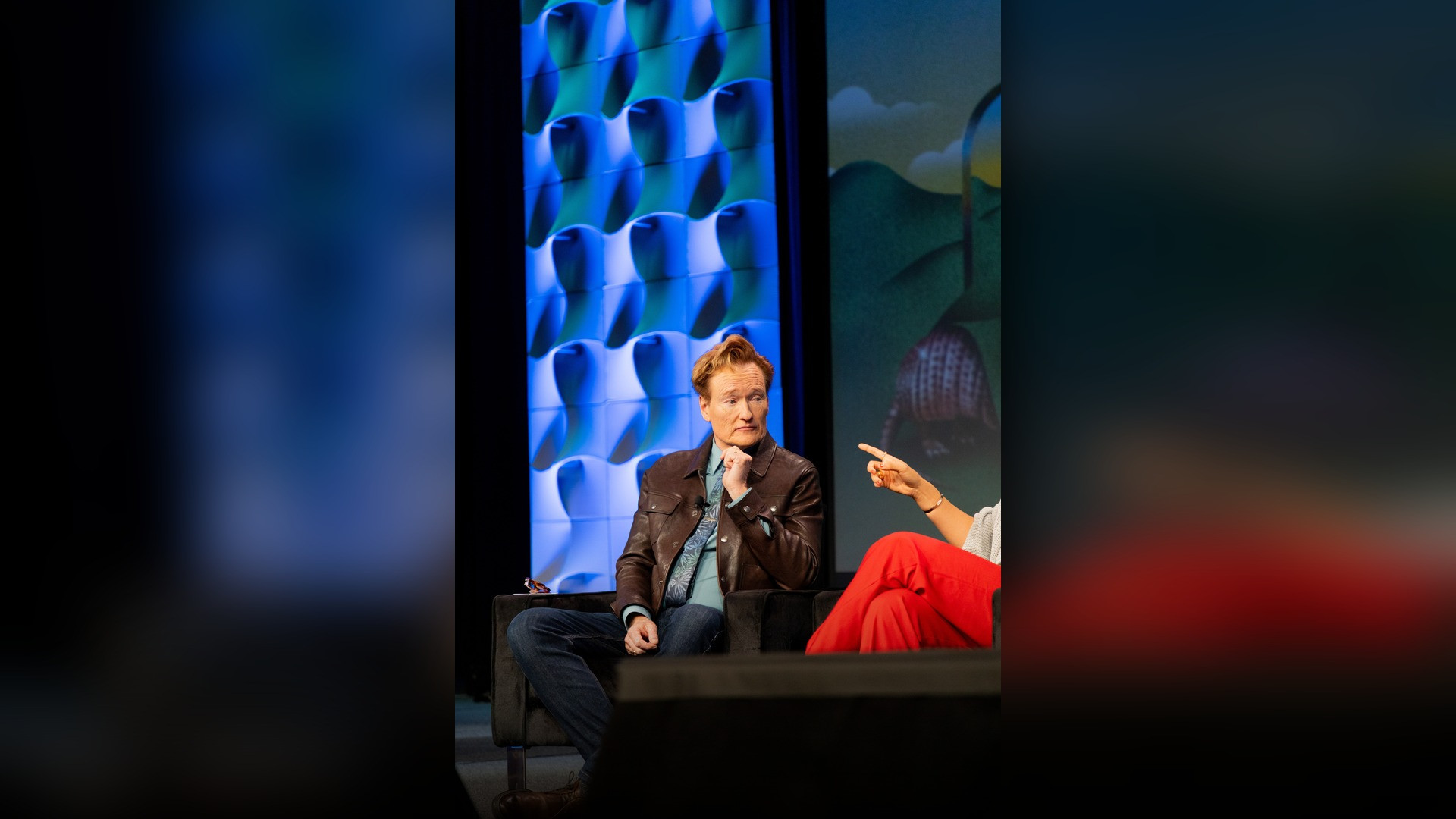 High-resolution portrait photograph of Conan O'Brien celebrating academic achievement.
