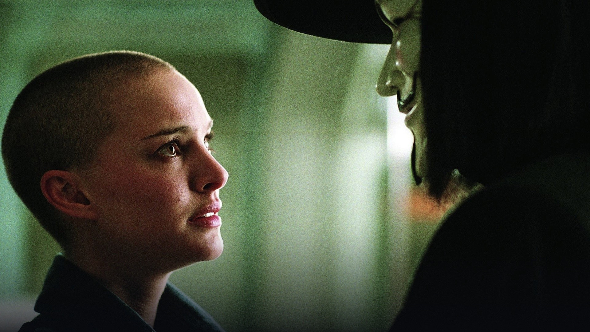 Official film still from V for Vendetta showing Natalie Portman with a freshly shaved head as Evey Hammond