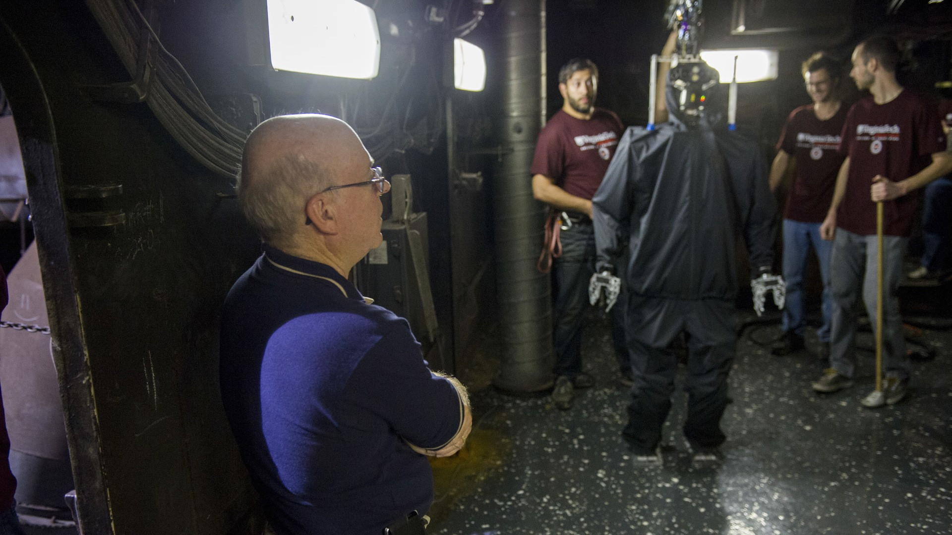 Full-body bipedal humanoid robot prototype standing in an engineering robotics laboratory.