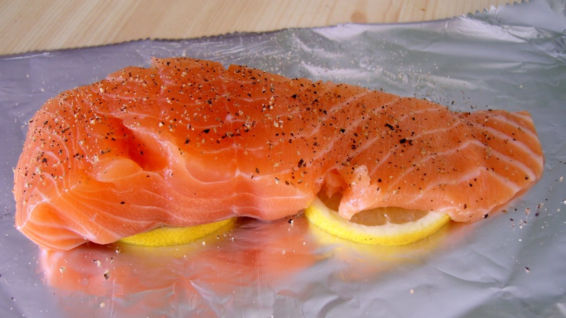 Fresh salmon fillet with pepper and lemon
