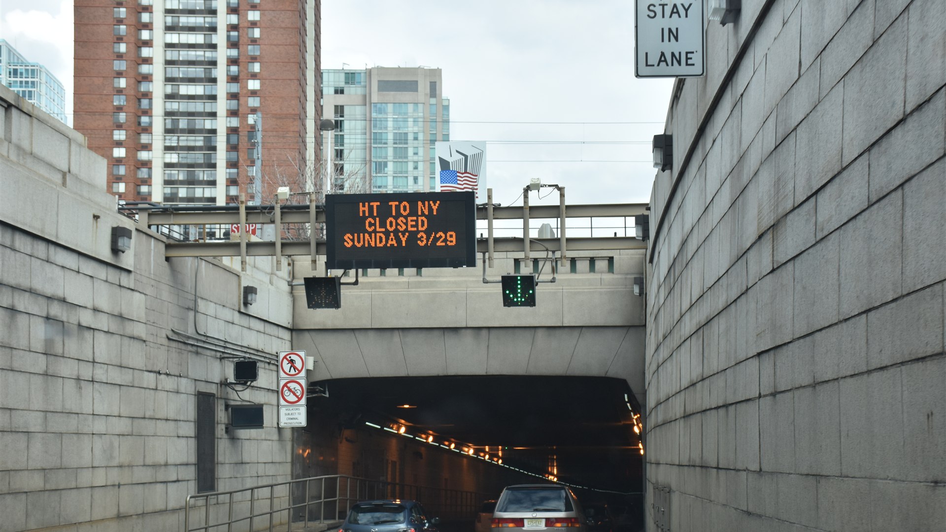 Entrance to the Holland Tunnel with tiled walls and lanes vanishing underground