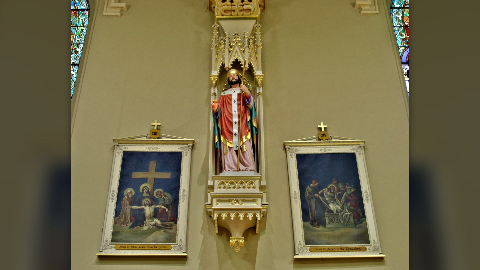 Sculpted statue of Saint Augustine holding a flaming heart, the symbol on Pope Leo XIV's coat of arms