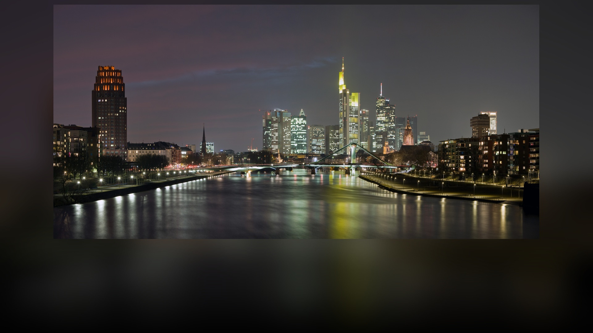 Frankfurt am Main banking district skyline across the Main river in Germany.
