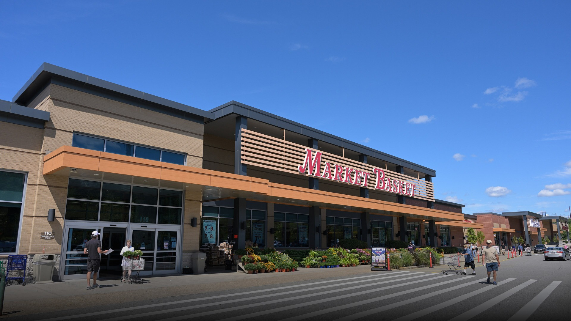 Photograph of Market Basket supermarket storefront celebrating family grocery excellence.