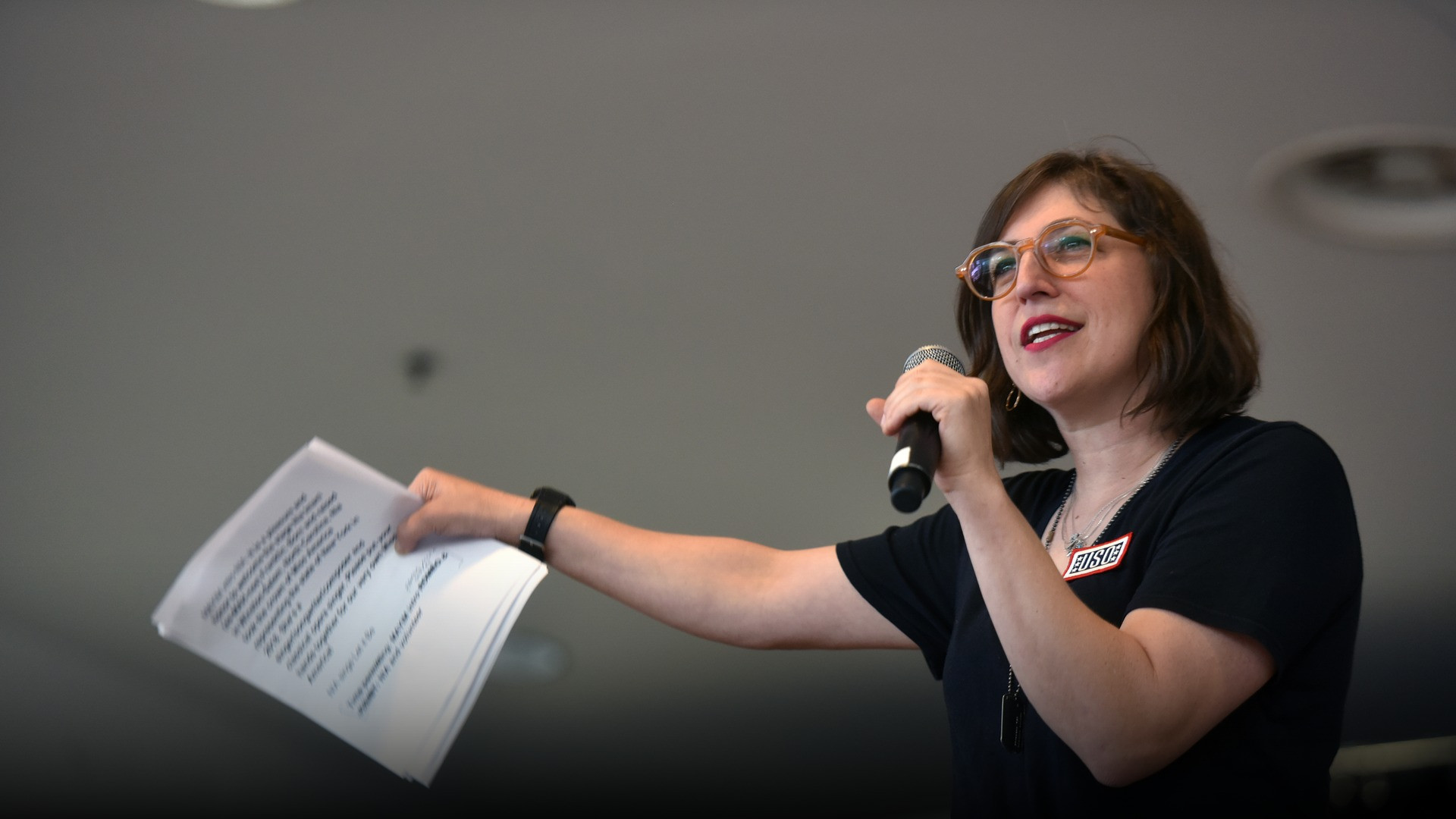High-resolution portrait photograph of Mayim Bialik celebrating academic achievement.