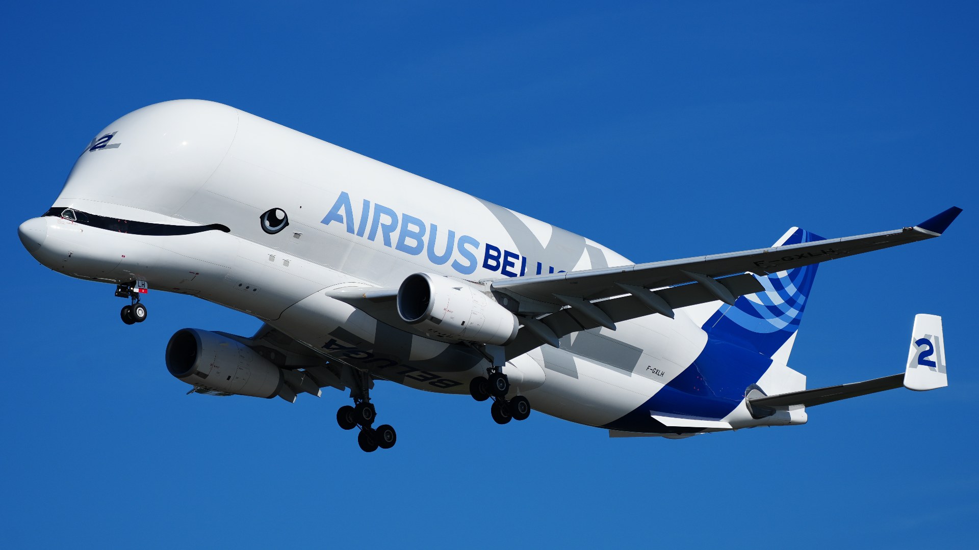 Airbus A330-743L BelugaXL super-transporter aircraft in flight approaching Hamburg-Finkenwerder Airport.