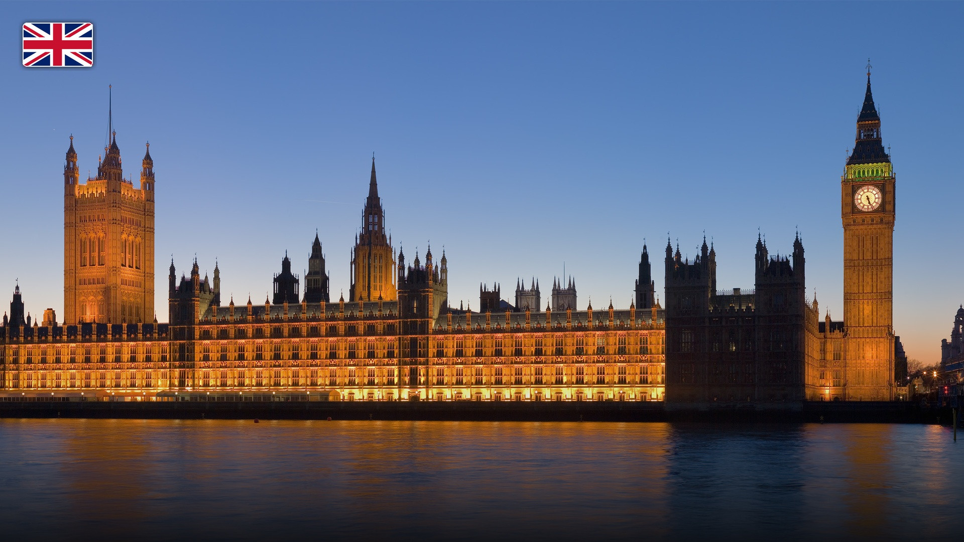 The iconic clock tower Big Ben and Palace of Westminster beside the River Thames, with the flag of the United Kingdom.