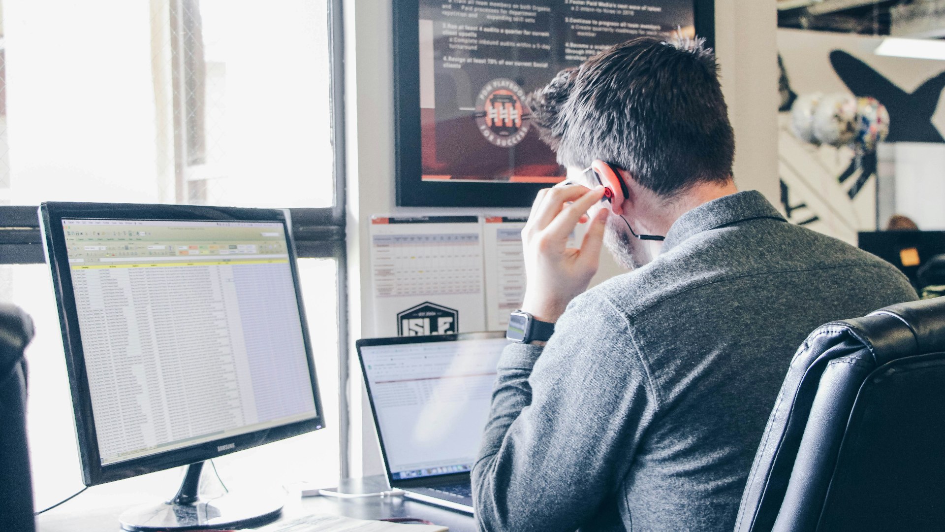Office worker sitting at a desk working on a laptop for prolonged hours