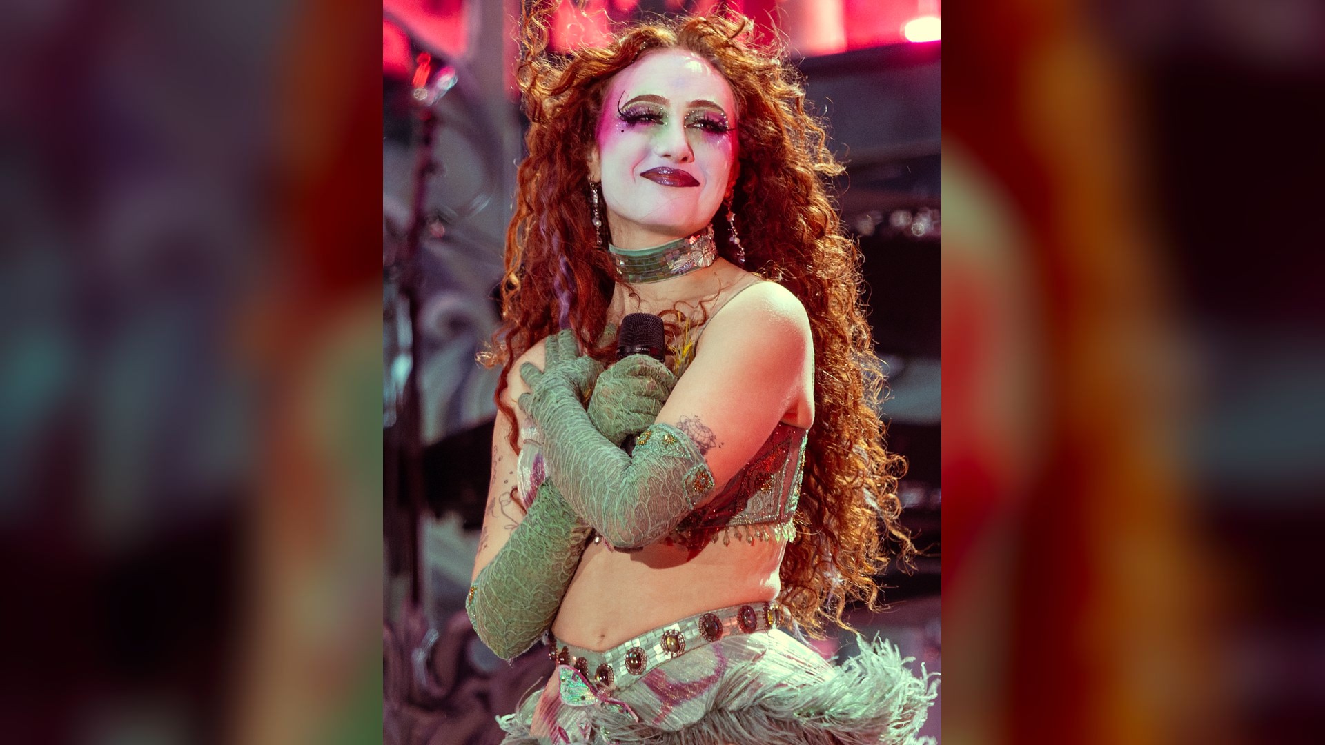 Chappell Roan performing in theatrical makeup and elaborate stage costume.