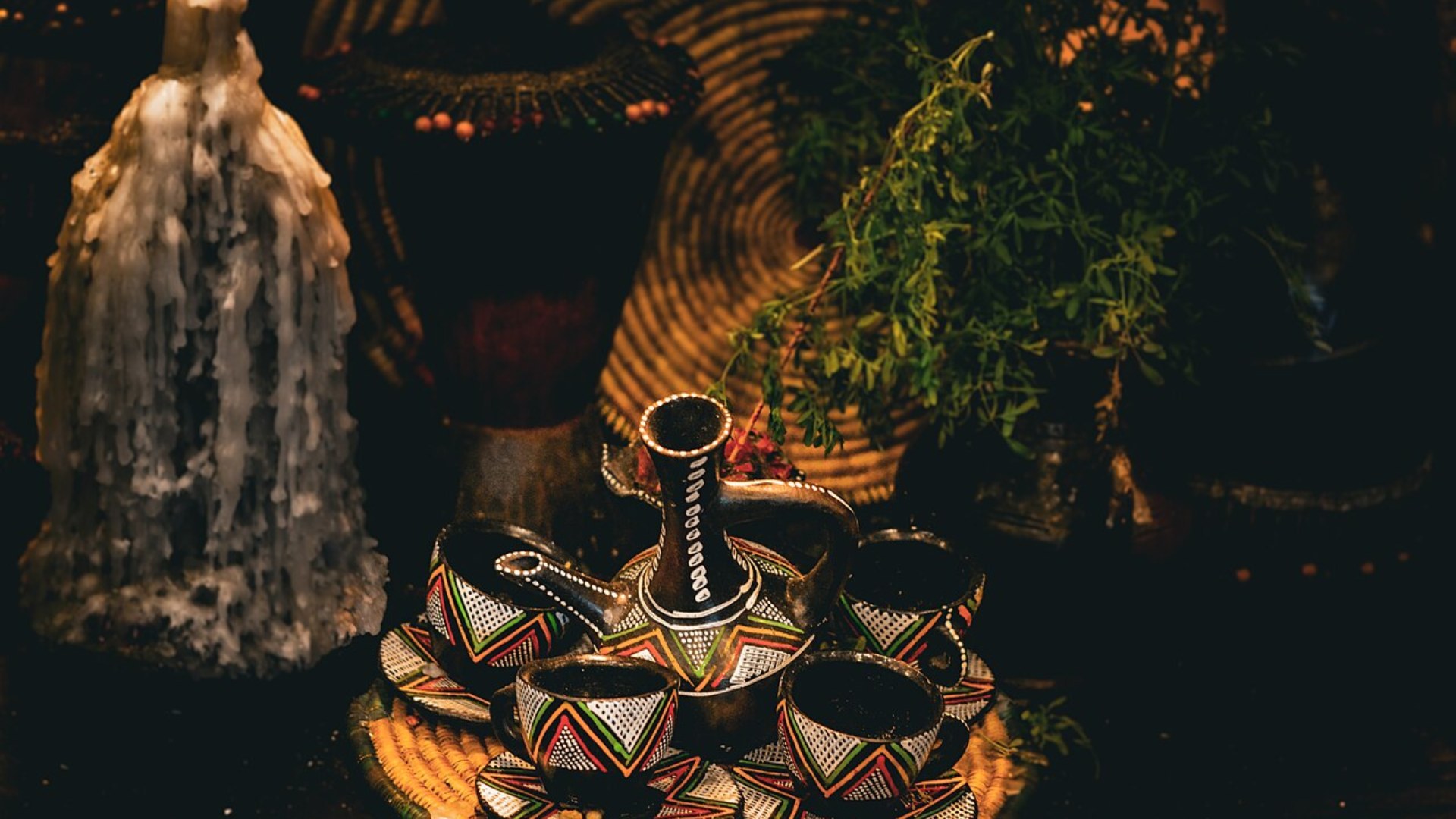 Ethiopian coffee ceremony tray with jebena clay pot, small ceramic cups and incense
