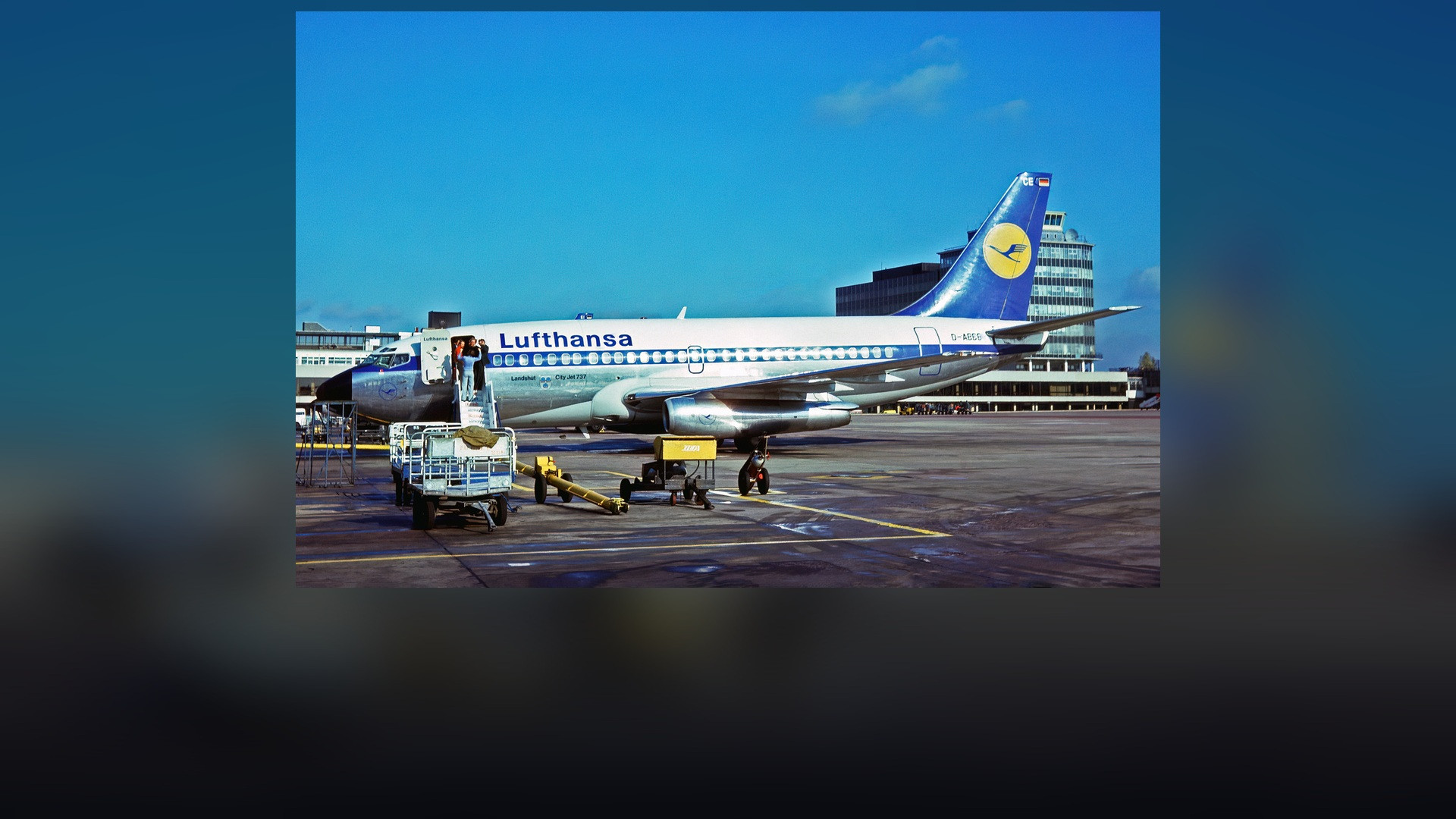 Lufthansa Boeing 737 passenger airliner in classic yellow and blue crane livery on the tarmac.