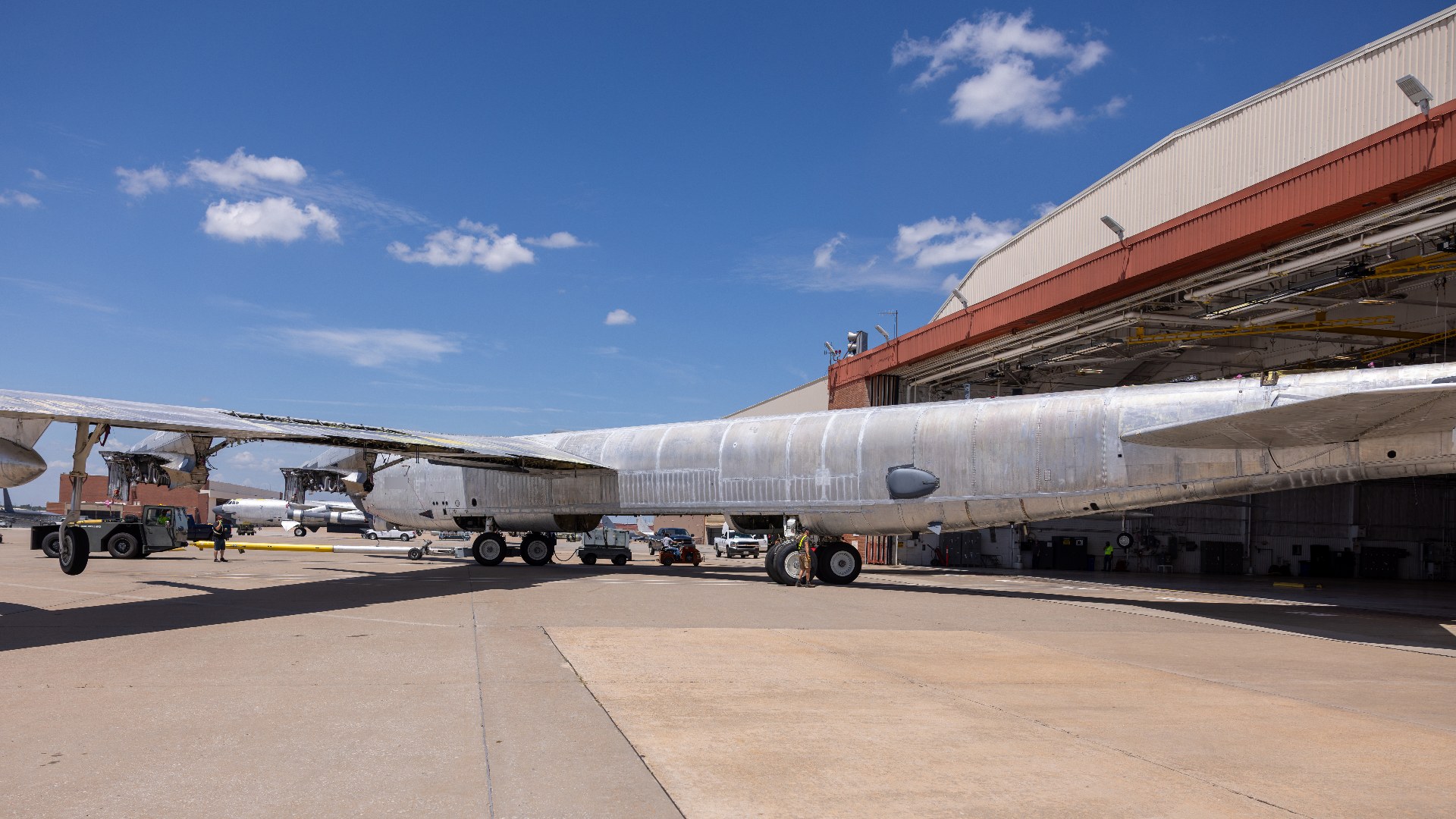 U.S. Air Force Boeing B-52H Stratofortress heavy bomber being towed into a maintenance hangar at Tinker Air Force Base.