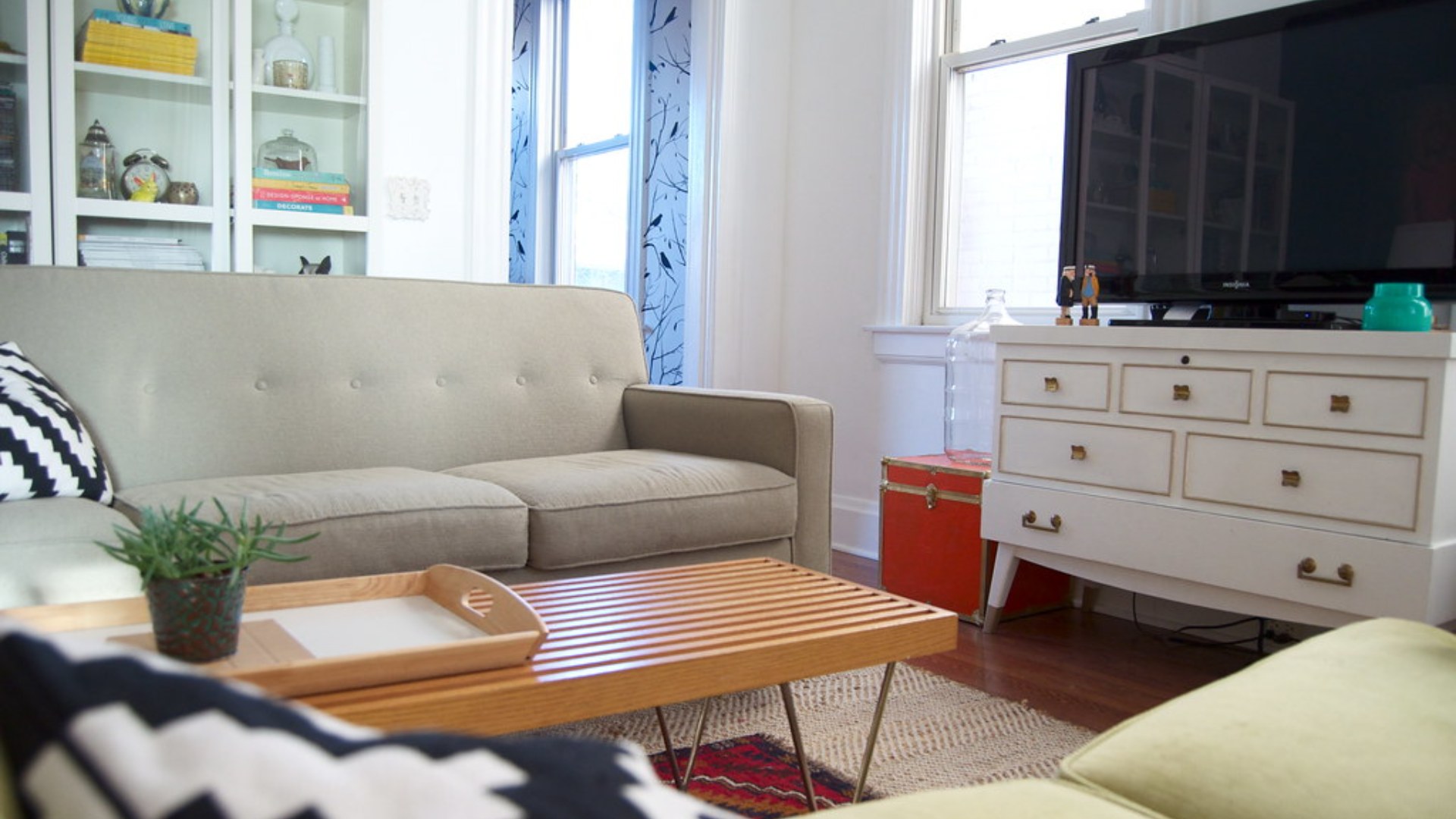 Cozy living room with updated furniture and a reading corner