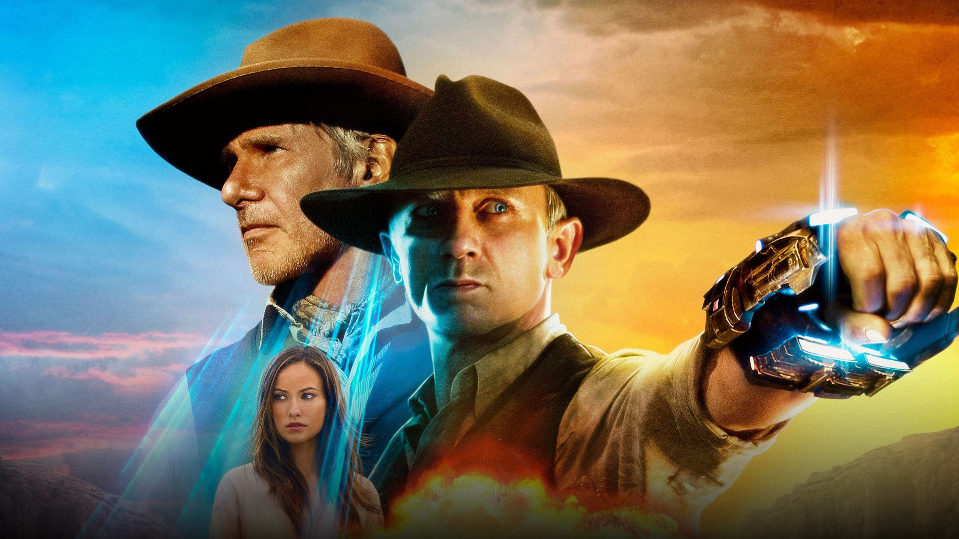 Daniel Craig with a glowing alien wrist shackle standing in a dusty Western town shootout at dusk
