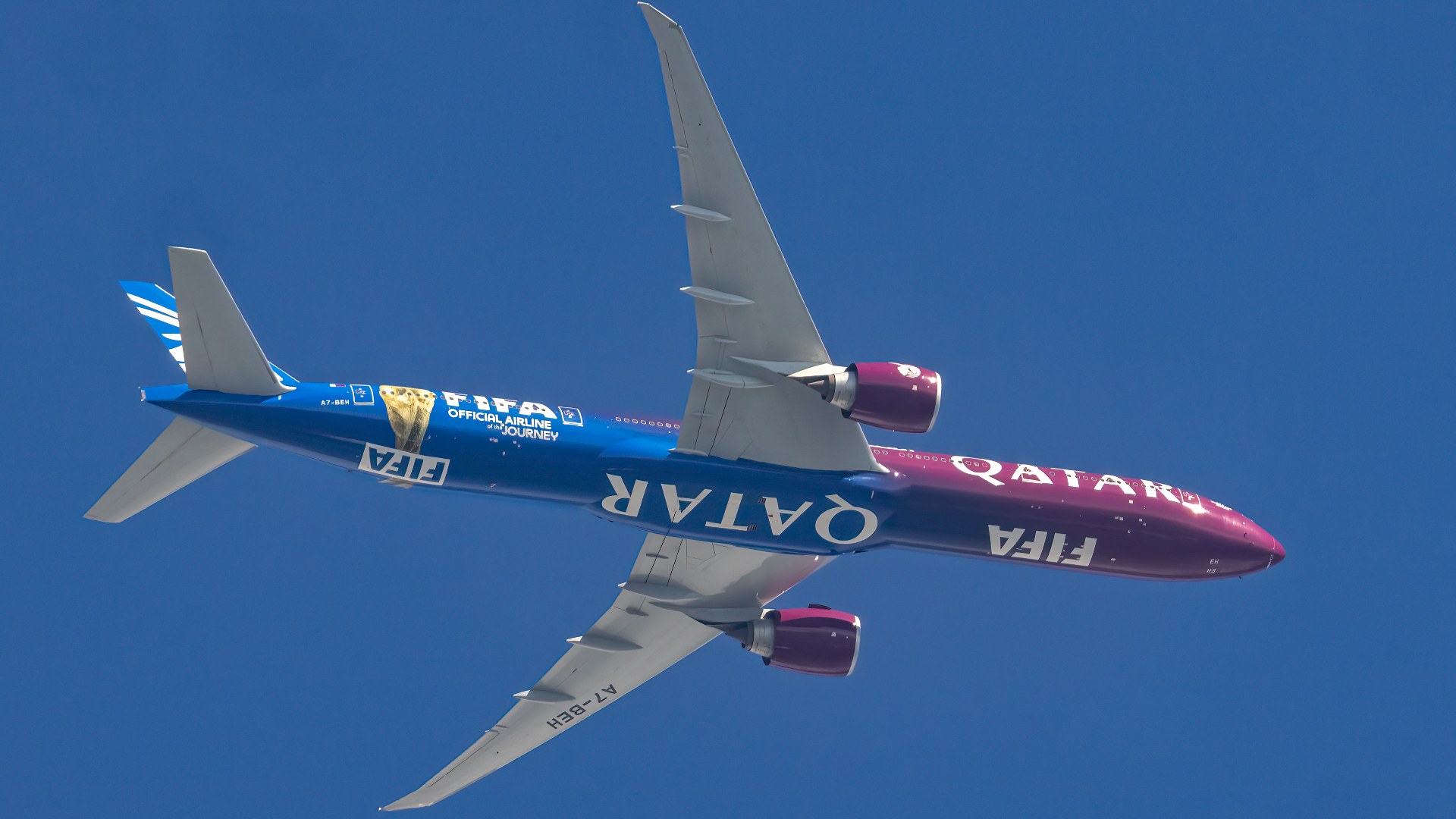 Qatar Airways Boeing 777-300ER twin-engine widebody jetliner in flight over Maryland.