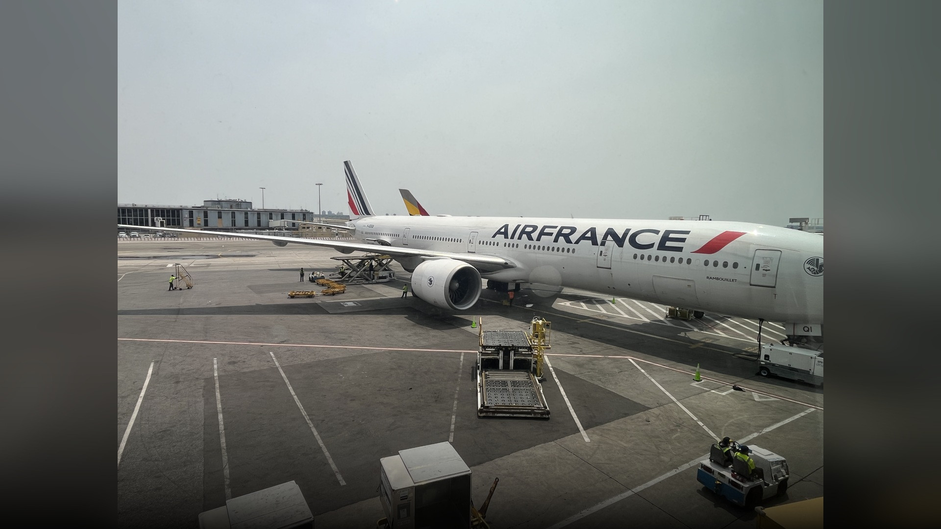 An international widebody passenger airliner at the terminal gate at John F. Kennedy International Airport in New York.