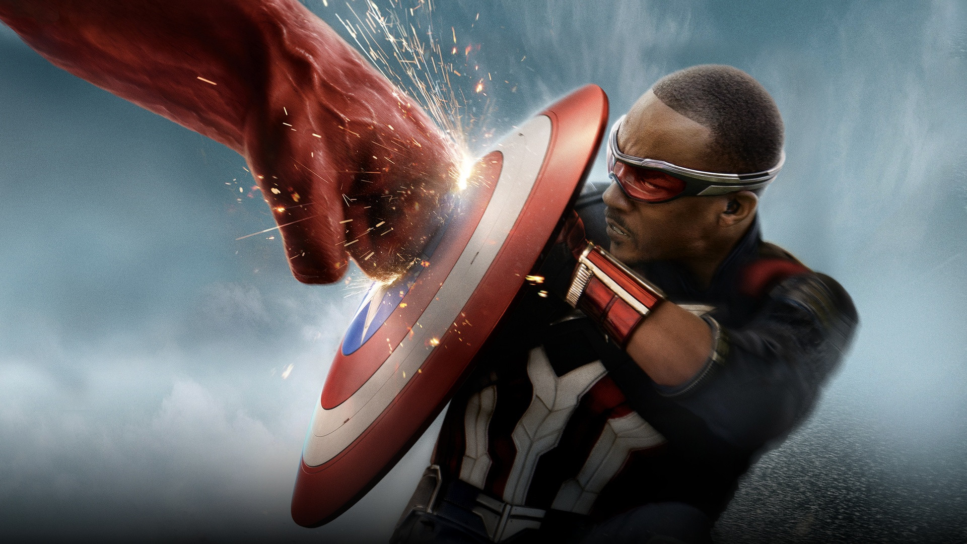 Anthony Mackie as Captain America blocking Red Hulk's massive fist with the vibranium shield.