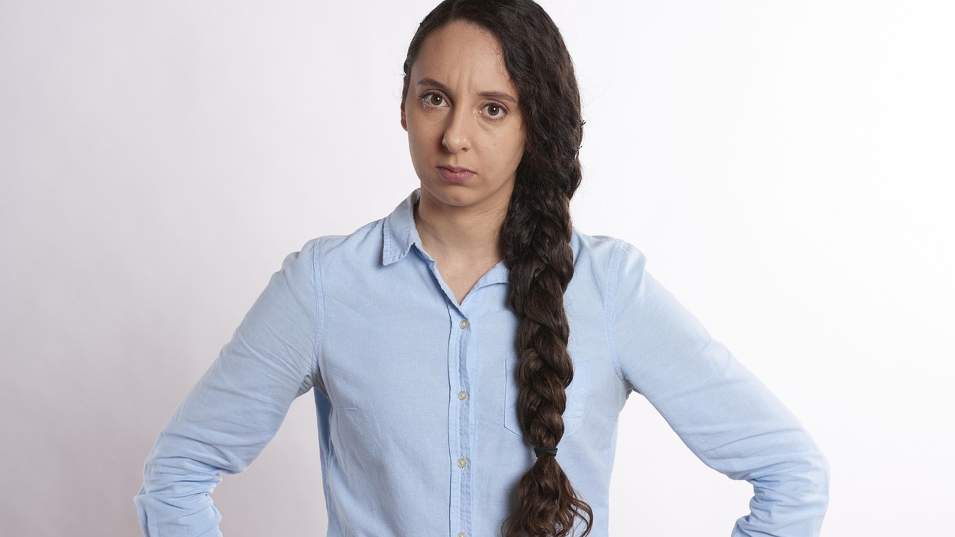 Woman looking skeptical and unimpressed with a dismissive expression