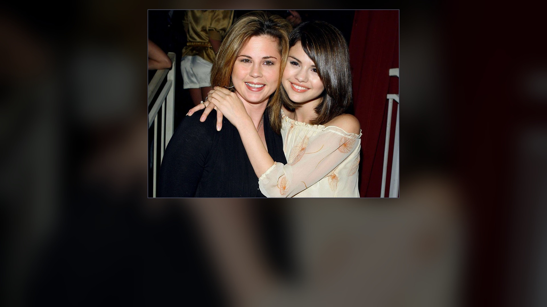 Mandy Teefey smiling alongside daughter Selena Gomez at an entertainment industry premiere.
