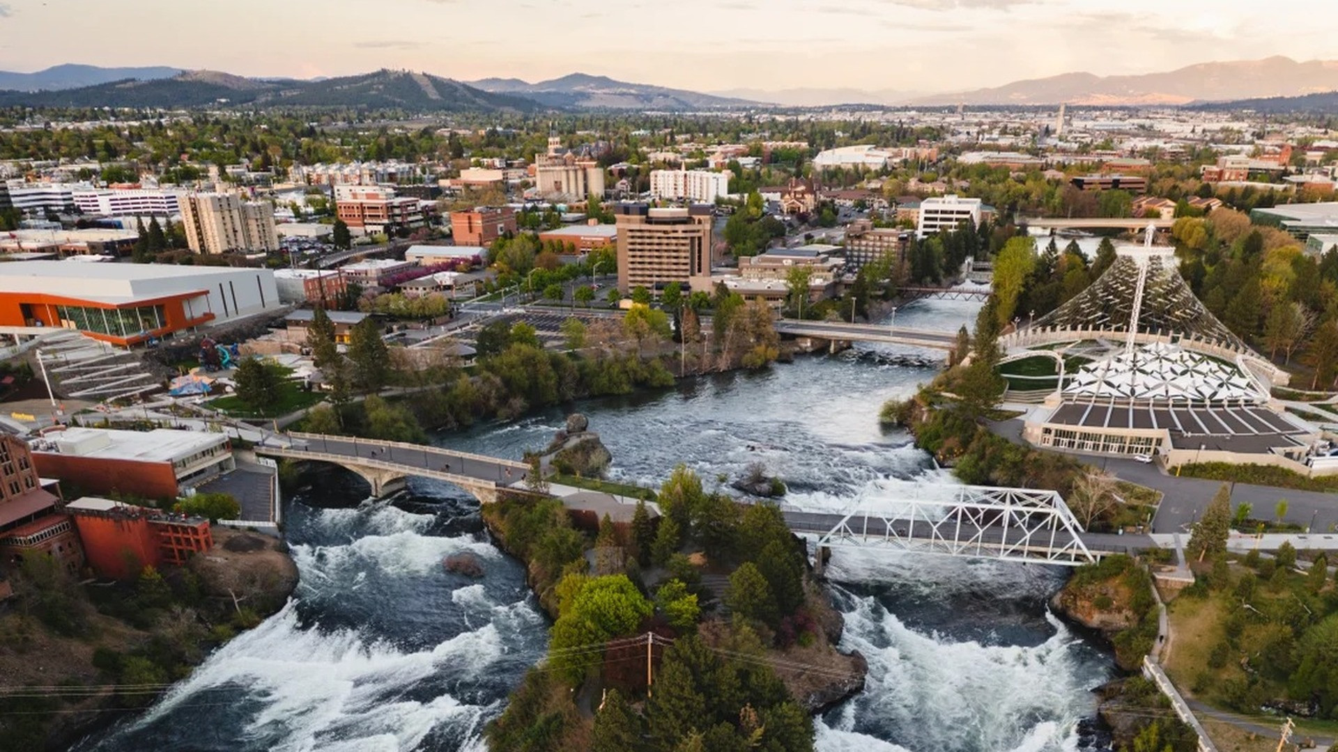 Scenic Spokane Falls rushing through the rocky urban canyon in downtown Spokane, Washington.