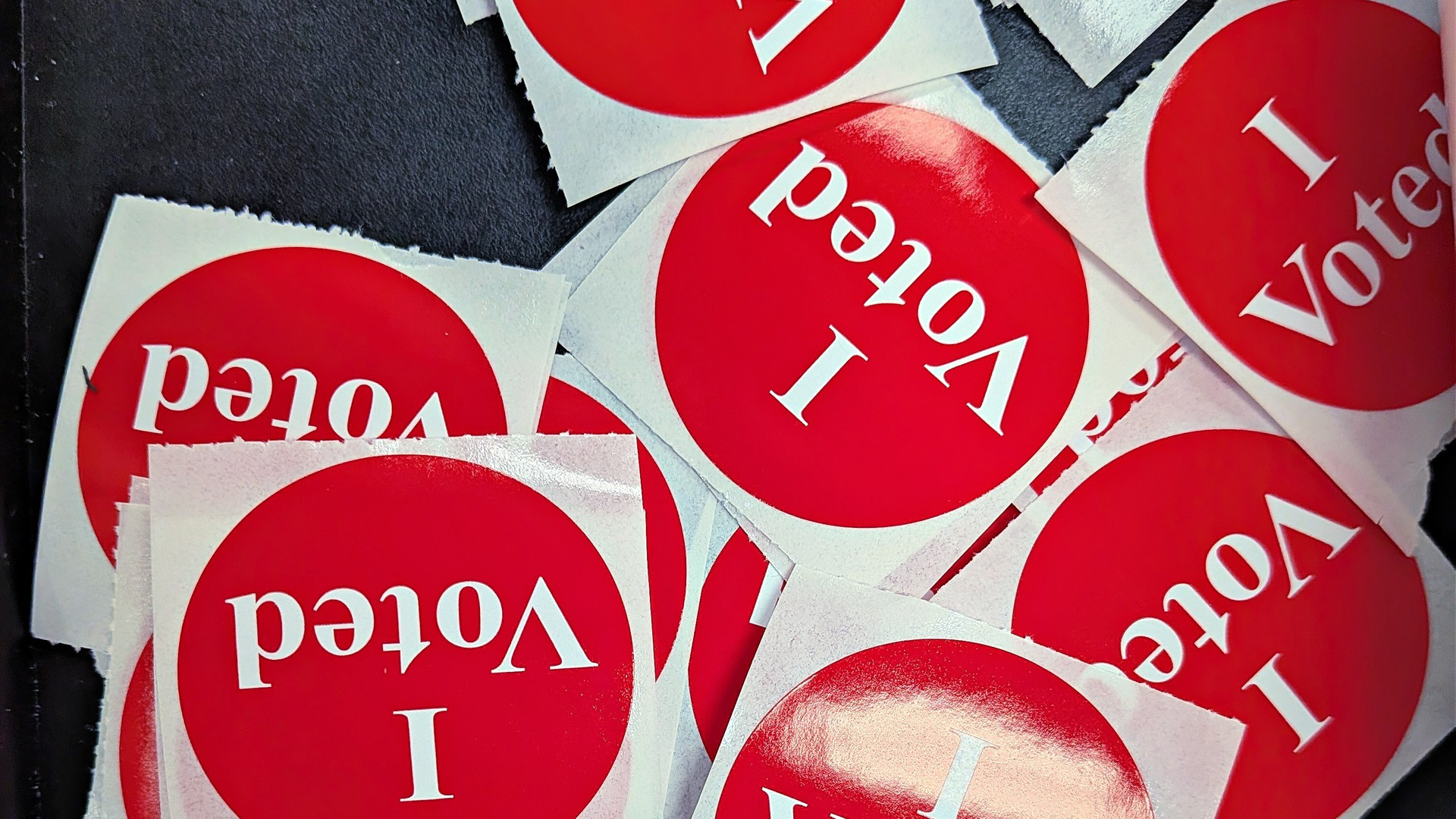 Vibrant pile of official American I Voted stickers.