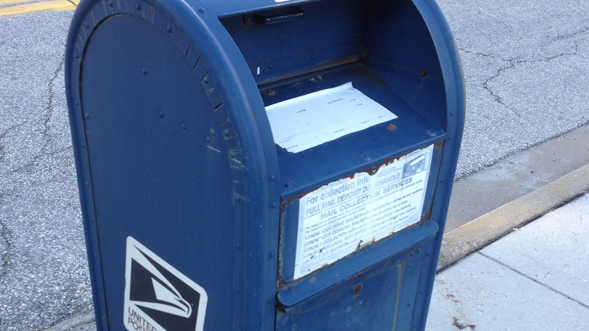 USPS postal mailbox reflecting change of address and voter registration updates.